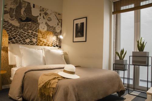 Ένα ή περισσότερα κρεβάτια σε δωμάτιο στο room Select Liberdade