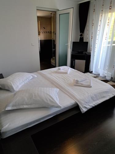Postel nebo postele na pokoji v ubytování Drag De Munte