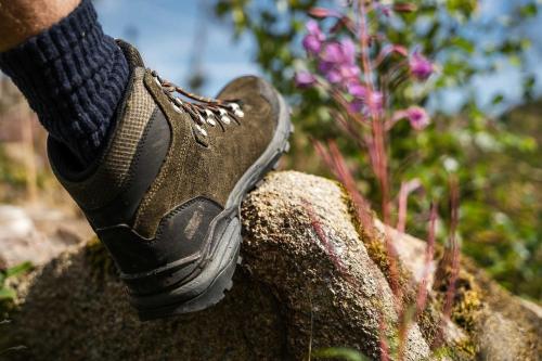 a persons foot in a shoe on a rock at Pension Zum Hexenstieg in Schierke