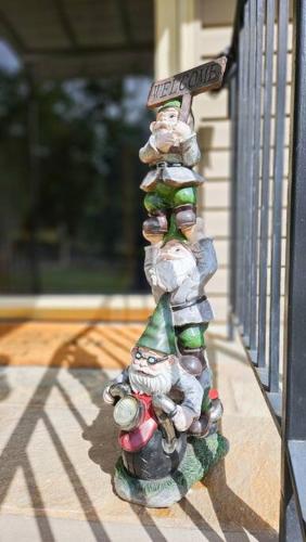 a stack of gnomes on the side of a house at Luxury getaway in woods, Jacuzzi, Hot Tub, Pool in Bushkill