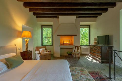 a bedroom with a bed and a fireplace at Massimago Wine Tower in Padova