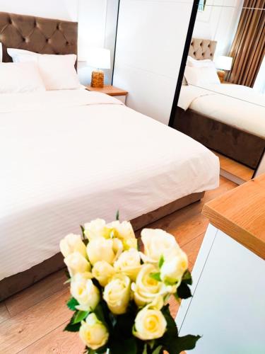 Ένα ή περισσότερα κρεβάτια σε δωμάτιο στο Emerald Apartment On Arena Oradea