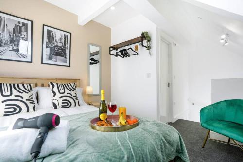 a bedroom with a bed with a tray of food and drinks at Central Buckingham Apartment #2 with Free Parking, Pool Table, Fast Wifi and Smart TV with Netflix by Yoko Property in Buckingham