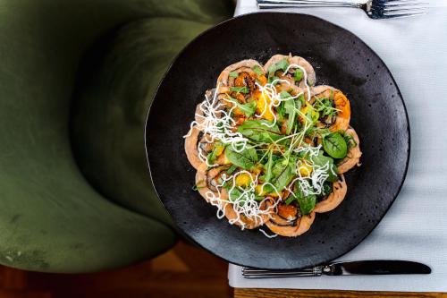 a plate of food on top of a table at Hotel Haffner Resort & Spa - Destigo Hotels in Sopot