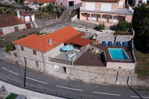 an aerial view of a house with a swimming pool at Emily's House in Arcos de Valdevez