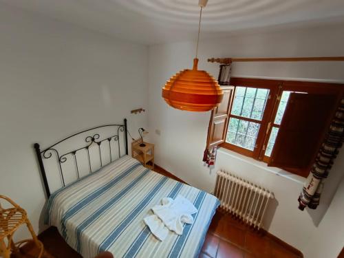 A bed or beds in a room at Casa Rural La Argentina