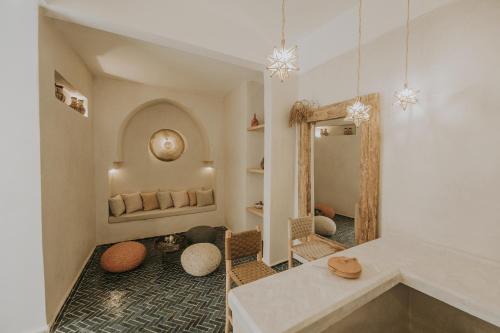 a bathroom with a large mirror and a sink at Riad Casa Kasbah in Marrakech