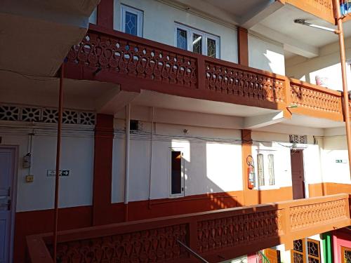 a building with balconies on the side of it at Urbban Castle in Port Blair