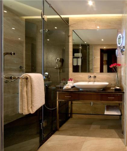 a bathroom with a sink and a shower at Fortune Park Dahej - Member ITC Hotels' Group in Dahej