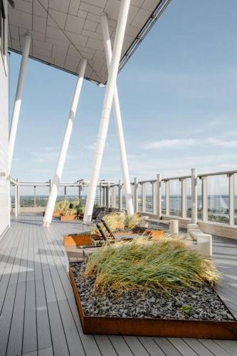 a deck of a cruise ship with plants on it at Fabulous Morden Apartment in Helsinki in Helsinki