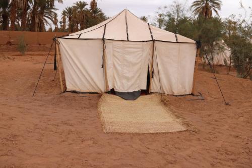a large tent in the middle of the desert at Bivouac Joudour Sahara in Mhamid