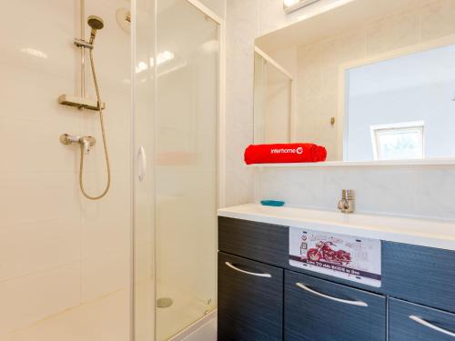 a bathroom with a shower and a sink at Apartment Le Domaine du Vert Coteau by Interhome in Touques