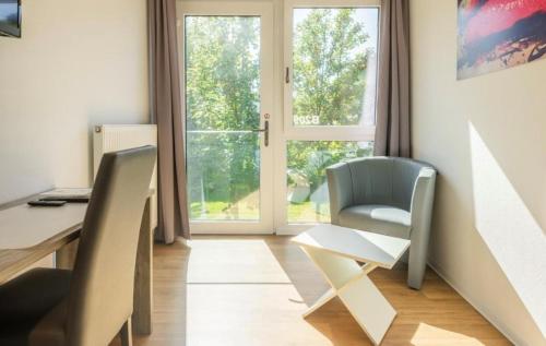 an office with a desk and a chair and a window at B - HOME Apartments in Koblenz