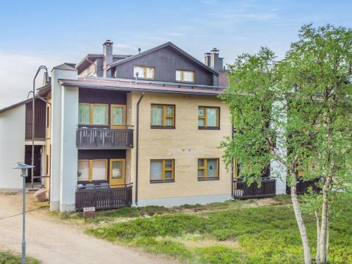 a large house with a balcony on a street at Holiday Home Lomariekko 6 a 4 pikkuriekko by Interhome in Saariselka