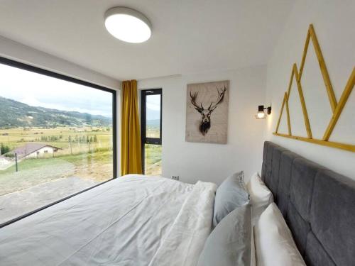 Voodi või voodid majutusasutuse Cozy Cube - tiny house toas