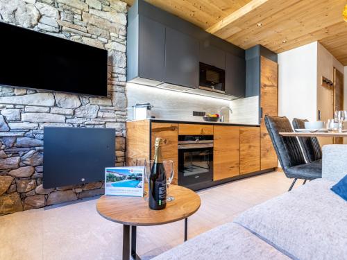un salon avec un canapé et une table dans l'établissement Apartment Rond Point des Pistes - Val Claret-21 by Interhome, à Tignes