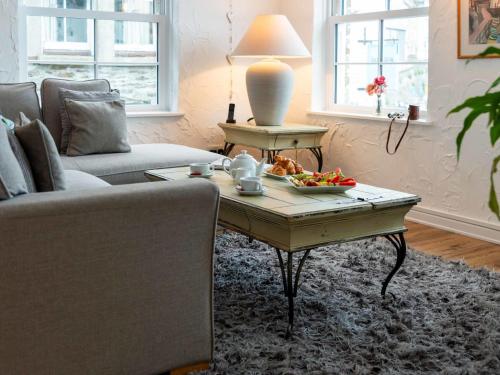 a living room with a coffee table and a couch at Apartment Lighthouse View by Interhome in Mevagissey