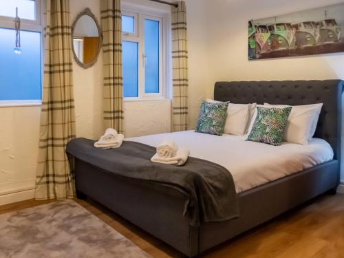 a bedroom with a bed with towels on it at Apartment Lighthouse View by Interhome in Mevagissey
