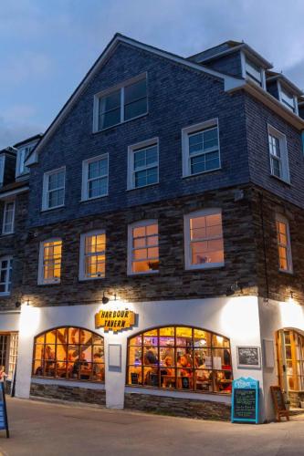 a building with a book store on the street at Apartment Lighthouse View by Interhome in Mevagissey