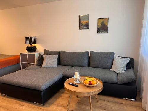 a living room with a couch and a table at Apartment Flachgau by Interhome in Saalbach-Hinterglemm