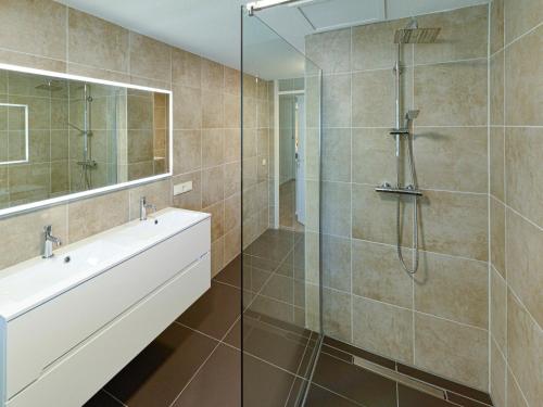 a bathroom with a shower and a sink at Holiday Home Citta Romana by Interhome in Hellevoetsluis