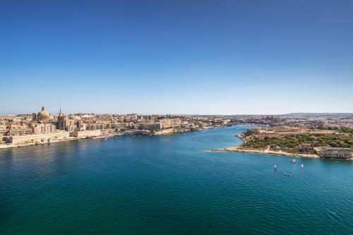 an aerial view of a river in a city at Barceló Fortina Malta in Sliema