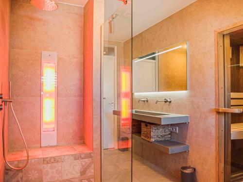 a bathroom with a sink and a mirror at Holiday Home Citta Romana by Interhome in Hellevoetsluis
