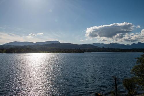 a view of a lake with mountains in the background at Langdale Chase Hotel in Windermere