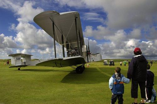 a group of people looking at a small airplane at Lake House Mannin, Ballyconneely in Ballyconneely