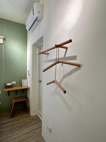 a room with wooden shelves on the wall at 山有巷宅 Alley House in Puli