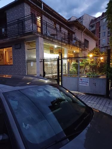 a car parked in front of a house at Guest House Lili in Petrich