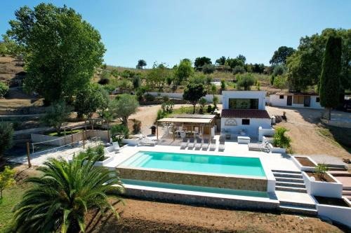 an aerial view of a house with a swimming pool at Marti Watersports in Martinchel