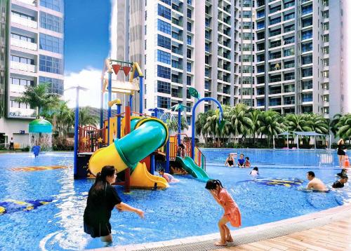 a group of people playing in a water park at Atlantis Residence Melaka by YouBNB Homestay in Melaka