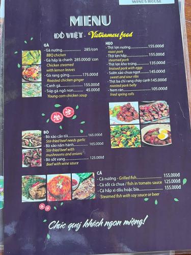 a menu for a restaurant with food on a chalkboard at Wind's House Ha Giang in Ha Giang
