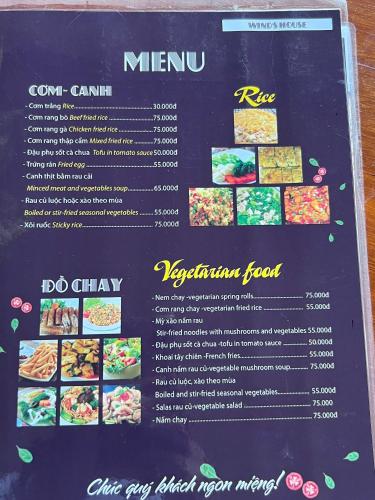 a sign for a restaurant with food on it at Wind's House Ha Giang in Ha Giang