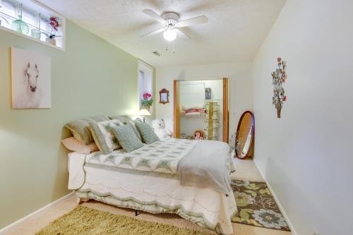 a bedroom with a bed and a ceiling fan at Fort Calhoun Home with Screened Porch and Playground! 