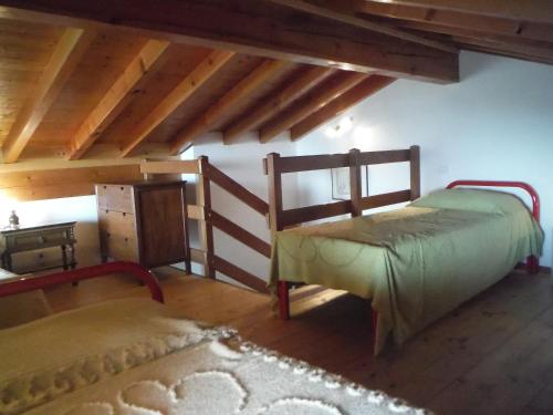 Кровать или кровати в номере Apartments Gravedona Panoramic