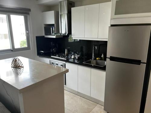 Η κουζίνα ή μικρή κουζίνα στο SOHA SUITES II