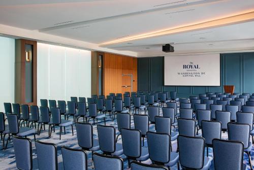an empty room with chairs and a screen at The Royal Sonesta Washington DC Capitol Hill in Washington