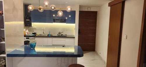 Kuchyň nebo kuchyňský kout v ubytování 1BHK LUXURY APARTMENT- Palayam