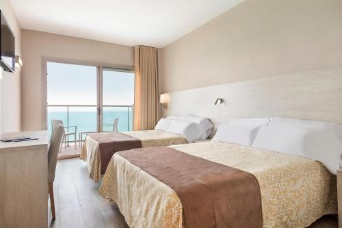 Postel nebo postele na pokoji v ubytování Hotel Best Negresco