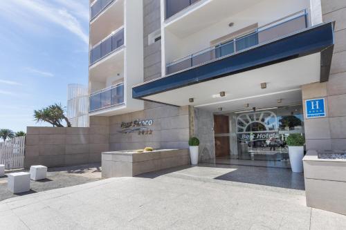 a facade of a building with a store at Hotel Best Siroco in Benalmádena