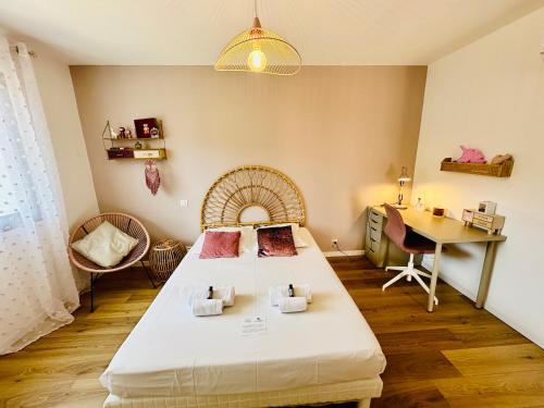a bedroom with a bed and a desk and a table at "Villa Cavone" vue mer - piscine privée in Ventiseri