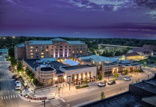 an aerial view of a city at night at The H Hotel in Midland