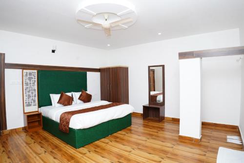 Postel nebo postele na pokoji v ubytování RICHBERRY- A Premium Plantation Villa's