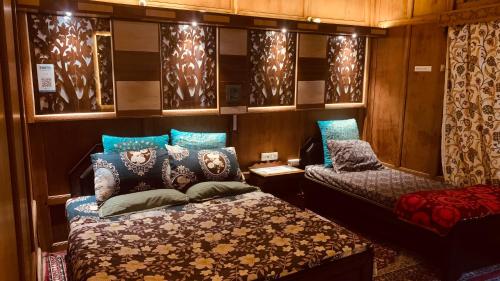 a train room with two beds and a couch at House Boat New Lucifer in Srinagar