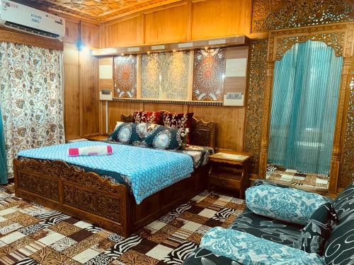 a bedroom with a bed in a room at House Boat New Lucifer in Srinagar