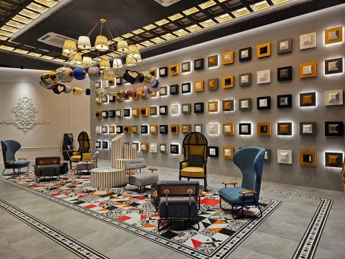 a waiting room with chairs and a rug at Arte Cheras The Premium Suites by iLuxHome in Kuala Lumpur