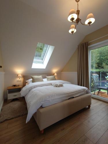 En eller flere senge i et værelse på Noclegi Panorama