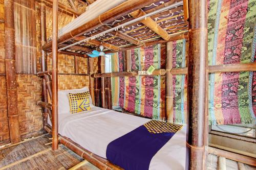 a bed in the inside of a room at SPOT ON 93006 Waithozz Bunkbeds in Yogyakarta